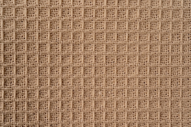 fabric natural texture as background. beige natural cotton waffle fabric texture as background