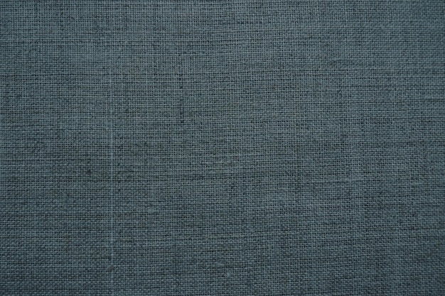 Fabric texture background dark gray fabric with weave natural slightly wrinkled look of the material