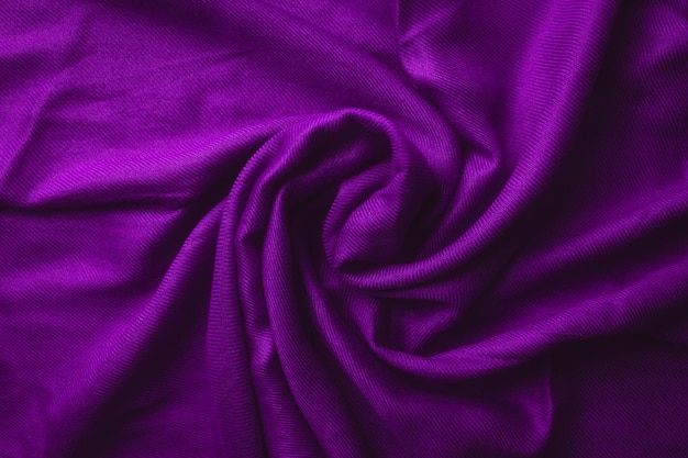 Fabric texture background of purple color (Very Peri). Close up of clothes as wallpaper.