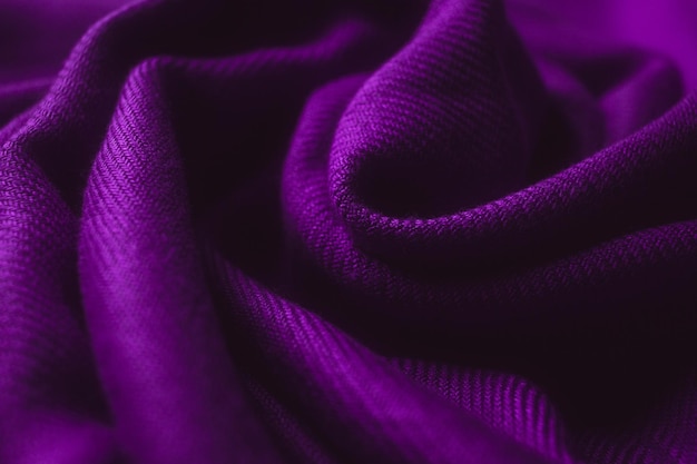 Fabric texture background of purple color (Very Peri). Close up of clothes as wallpaper.