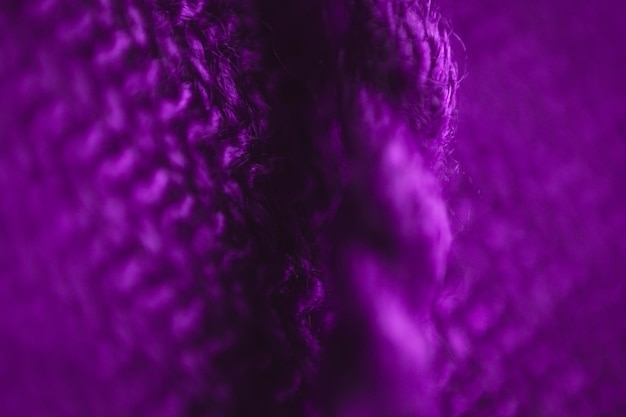 Fabric texture background of purple color (Very Peri). Close up of clothes as wallpaper.