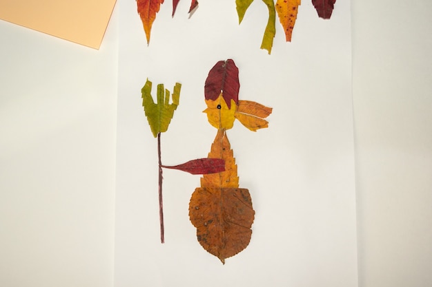 Fabulous character baba yaga from dry leaves. Craft application in autumn.