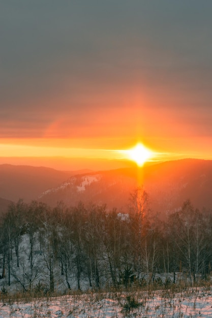 Fabulous panoramic view of the mountain valley at sunset. A ray of sun hitting the ground.