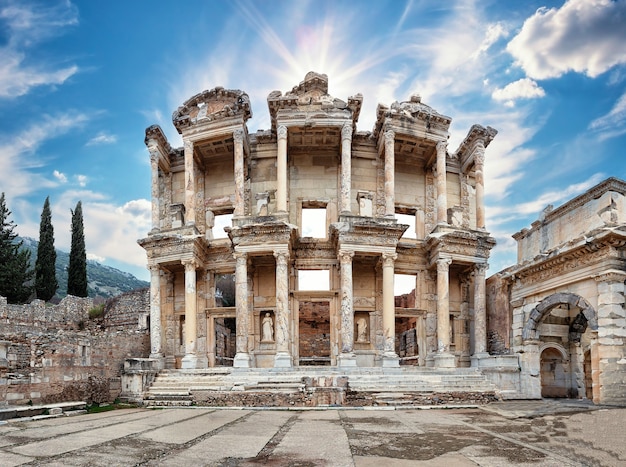 Facade of the antique library of Celsus in Ephesus under the bright sun. Panorama. Turkey