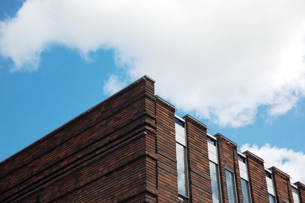 Facade fragment of a modern office building over blue sky, modern architecture