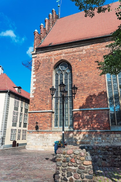 Facade of St John Church in the historical center of the old town of Riga, Latvia