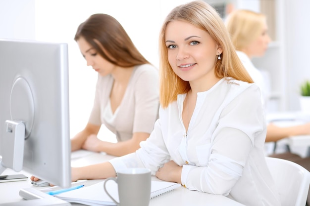 Face of beautiful business woman in office.