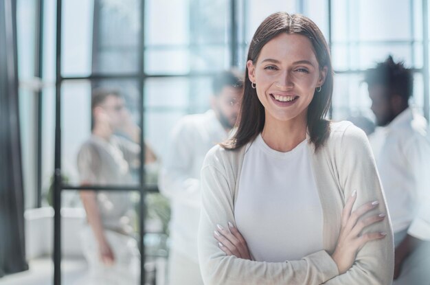 Face of beautiful woman on the background of business people