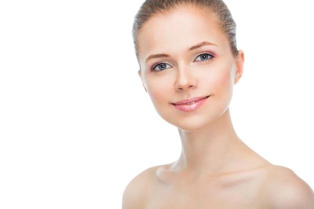 Face of a beautiful young woman on a white background