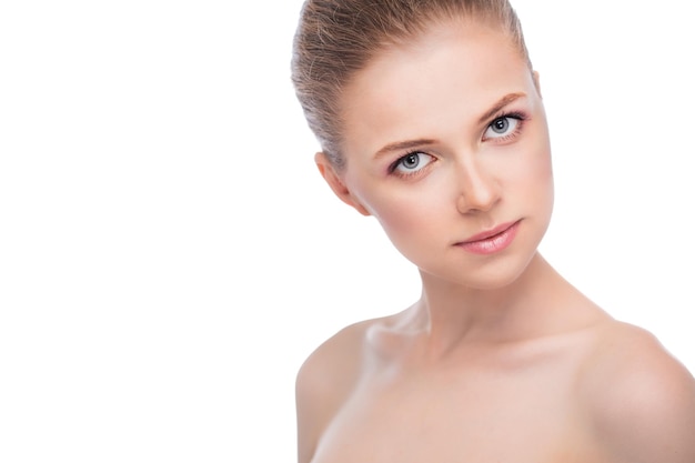 Face of a beautiful young woman on a white background