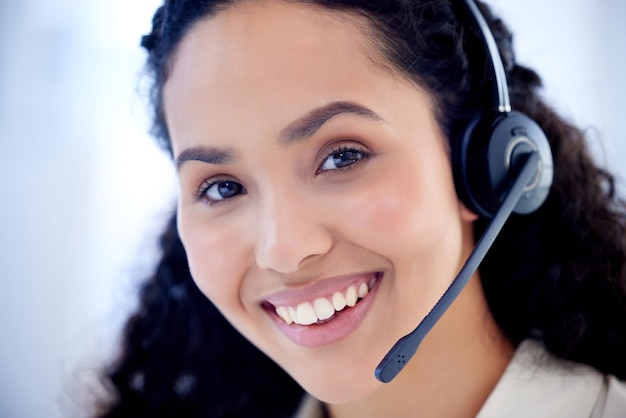 Face call center and woman smile for telemarketing customer service and support Contact us portrait and female sales agent crm professional and consultant from Brazil with pride for business