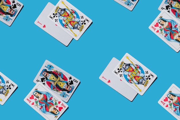 Face cards queens kings jacks aces on a blue background