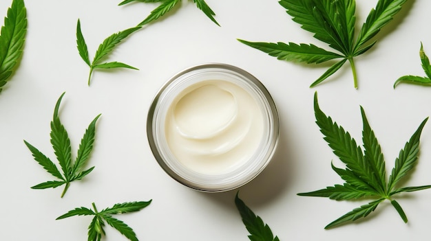 Face Cream and Hemp Plant Leaves Isolated on White Background