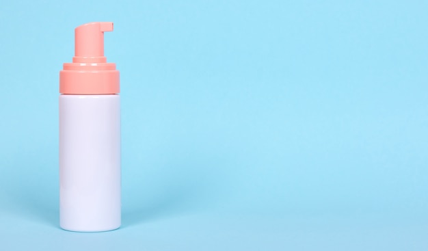 Face foam dispenser bottle, cosmetic lotion. Isolated.