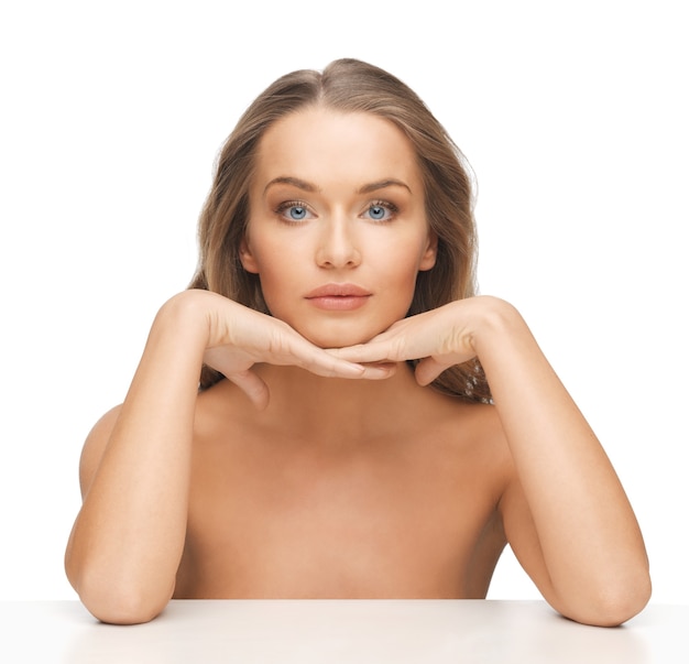 face and hands of beautiful woman with long hair