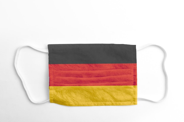 Face mask with printed Germany flag, on white background, isolated.