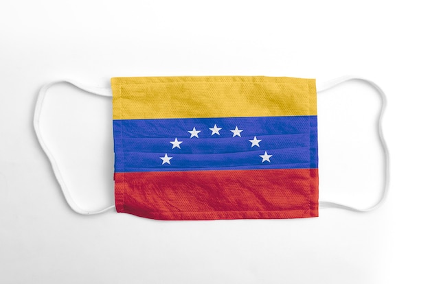 Face mask with printed Venezuela flag, on white background, isolated.