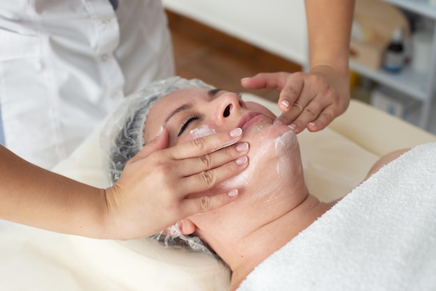 Face massage Closeup of woman getting spa massage treatment at beauty spa salonSpa skin and body