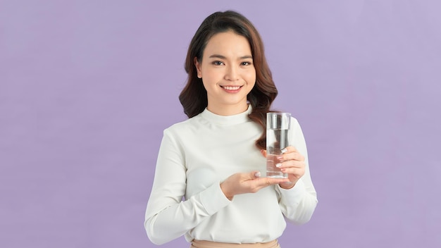 Face portrait of woman drinking water Smiling girl Isolated portrait