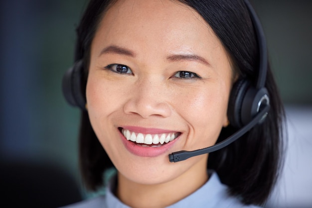 Face telemarketing and customer support working in a call center with happy smile Asian customer service operator with headset consulting help and online advice for contact us crm and consultant