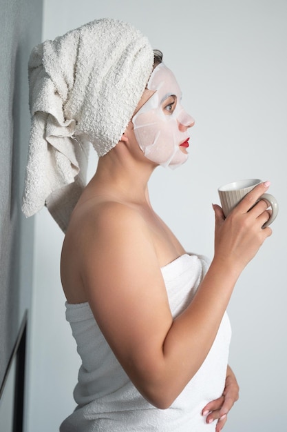 Facial care a girl and a fabric mask on her face