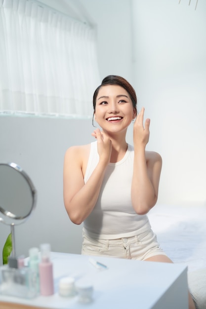 Facial makeup of young asian beautiful woman on white background