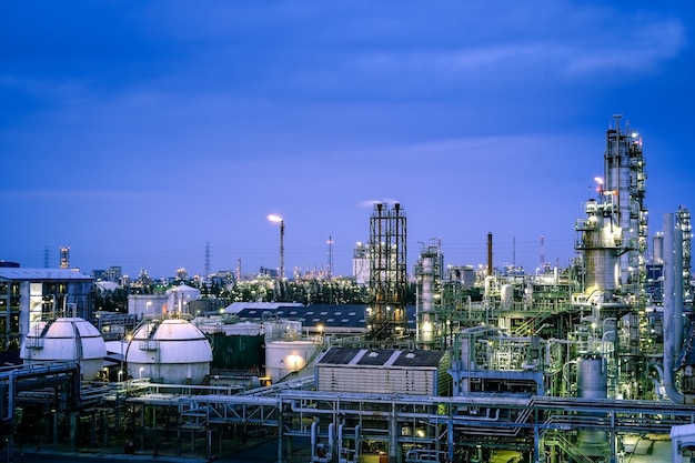 Factory of petrochemical plant with twilight sky background