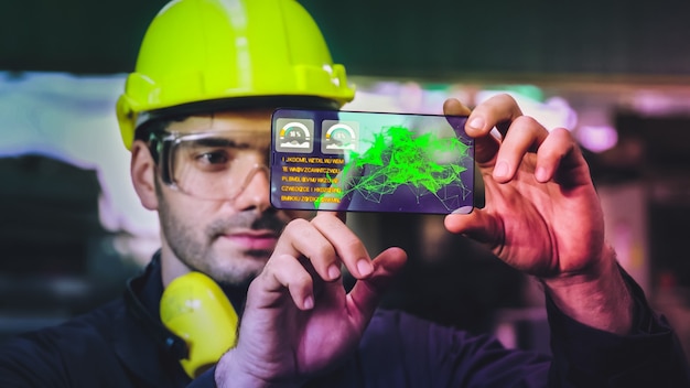 Factory worker use future holographic screen device to control manufacturing