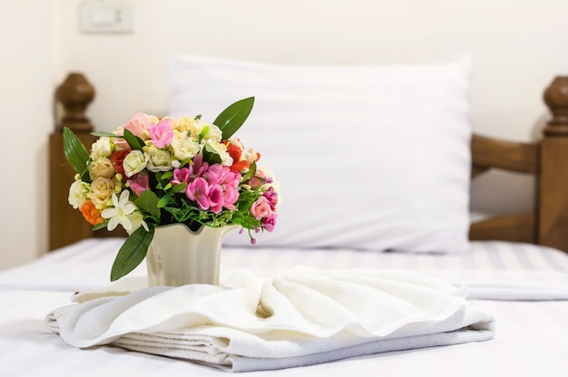 fake flower on bed in the Luxury Interior bedroom