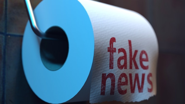 Fake news inscription on toilet paper in the toilet