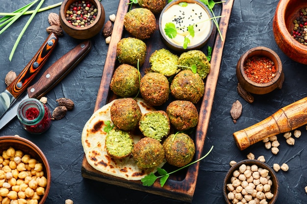 Falafel balls on a wooden cutting board.Arabic snack falafel