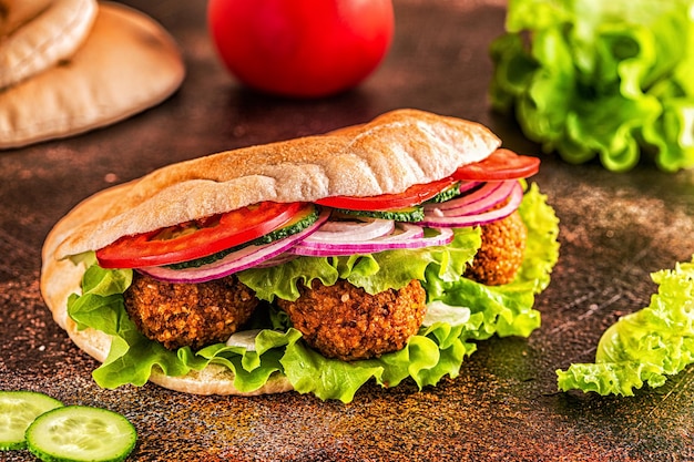 Falafel and fresh vegetables in pita bread