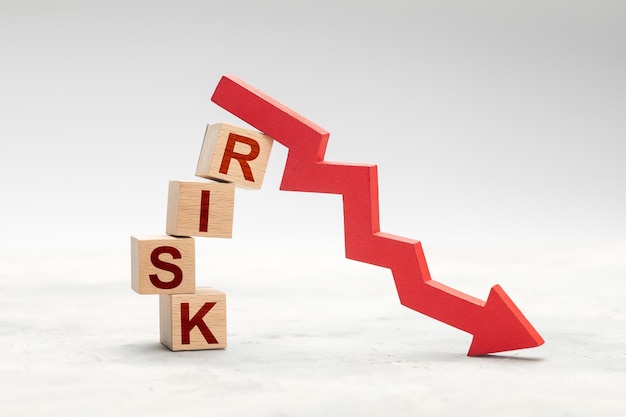 Fall risk Red down arrow as a symbol of crisis or risky investment