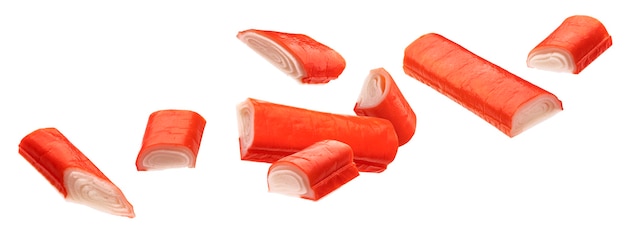 Falling crab sticks isolated on white background