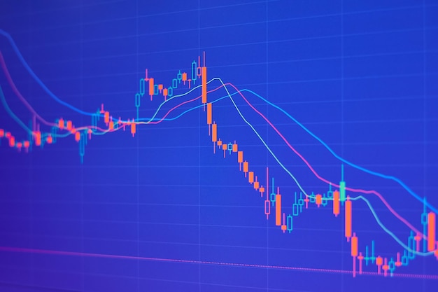 Falling stock market chart on blue background