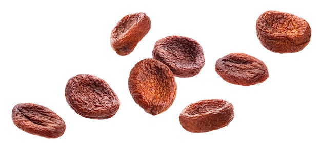 Falling sun dried apricots isolated on white background with clipping path