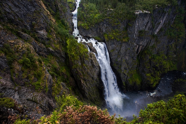 Falls in mountains of Norway in rainy weather.