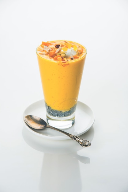 Falooda or Faluda is a popular Indian dessert - Strawberry and Mango flavoured which has Ice cream, noodles, sweet basil seeds and nuts, selective focus