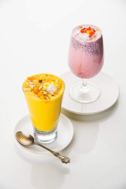 Falooda or Faluda is a popular Indian dessert - Strawberry and Mango flavoured which has Ice cream, noodles, sweet basil seeds and nuts, selective focus