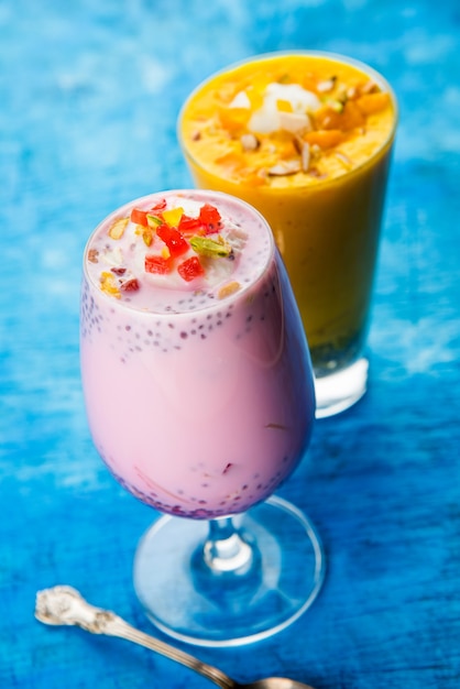 Falooda or Faluda is a popular Indian dessert - Strawberry and Mango flavoured which has Ice cream, noodles, sweet basil seeds and nuts, selective focus