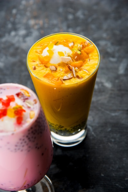 Falooda or Faluda is a popular Indian dessert - Strawberry and Mango flavoured which has Ice cream, noodles, sweet basil seeds and nuts, selective focus