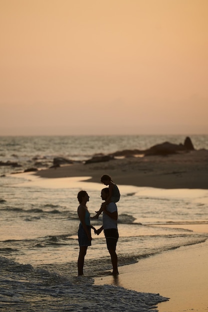 Family on Beach at Sunset