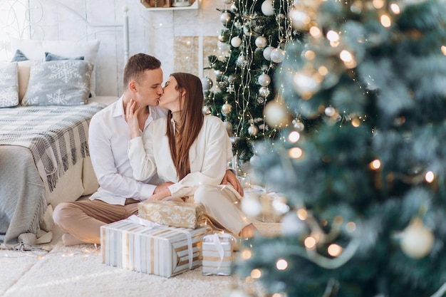 family celebrating new year near tree