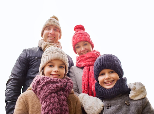 family, childhood, season and people concept - happy family outdoors