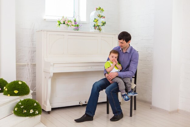 Family, children and fatherhood concept - Father and son having a good time.