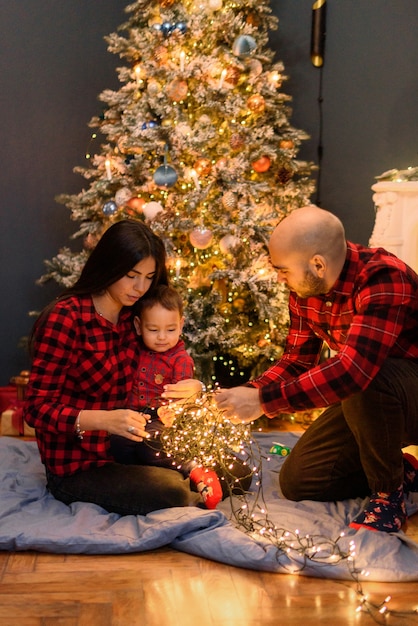 Family in Christmas decorations