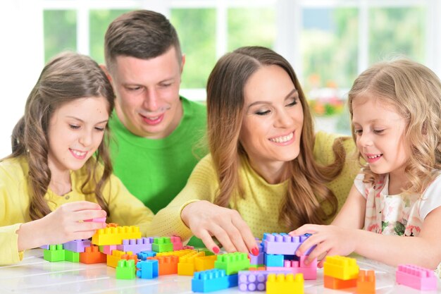 Family collecting blocks together