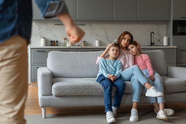 Family conflict shown with children and mother