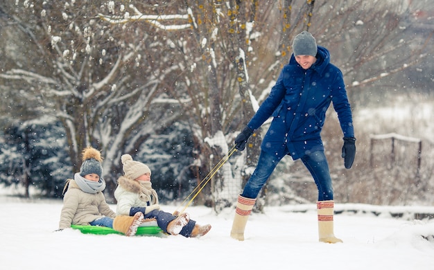 Family of dad and kids vacation on winter season