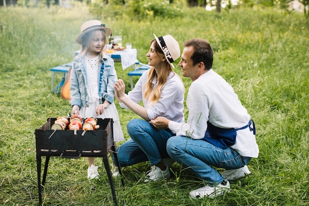 Family doing a barbecue in nature